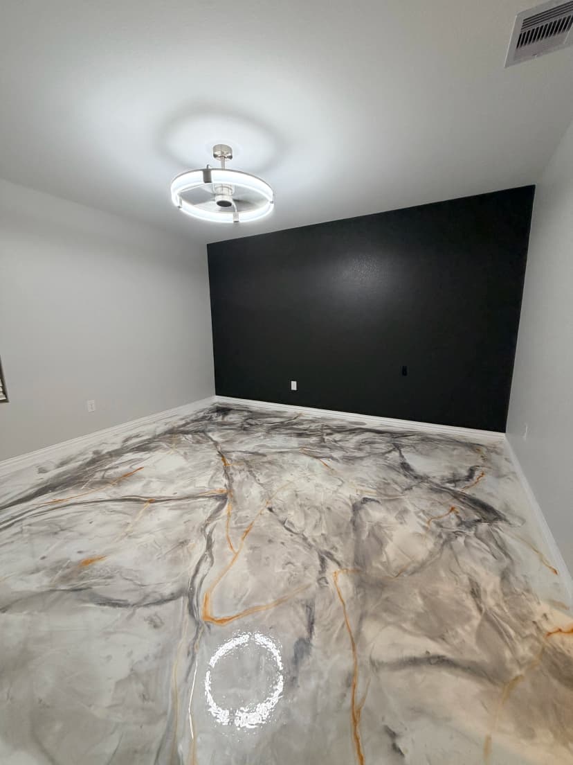 Residential Bedroom Gray and White Marbled Metallic Epoxy Floor With Black Accent Wall